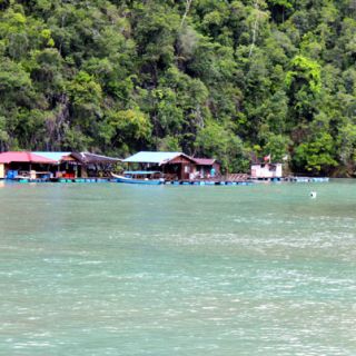 Sailing by a SE Asia fishing settlement